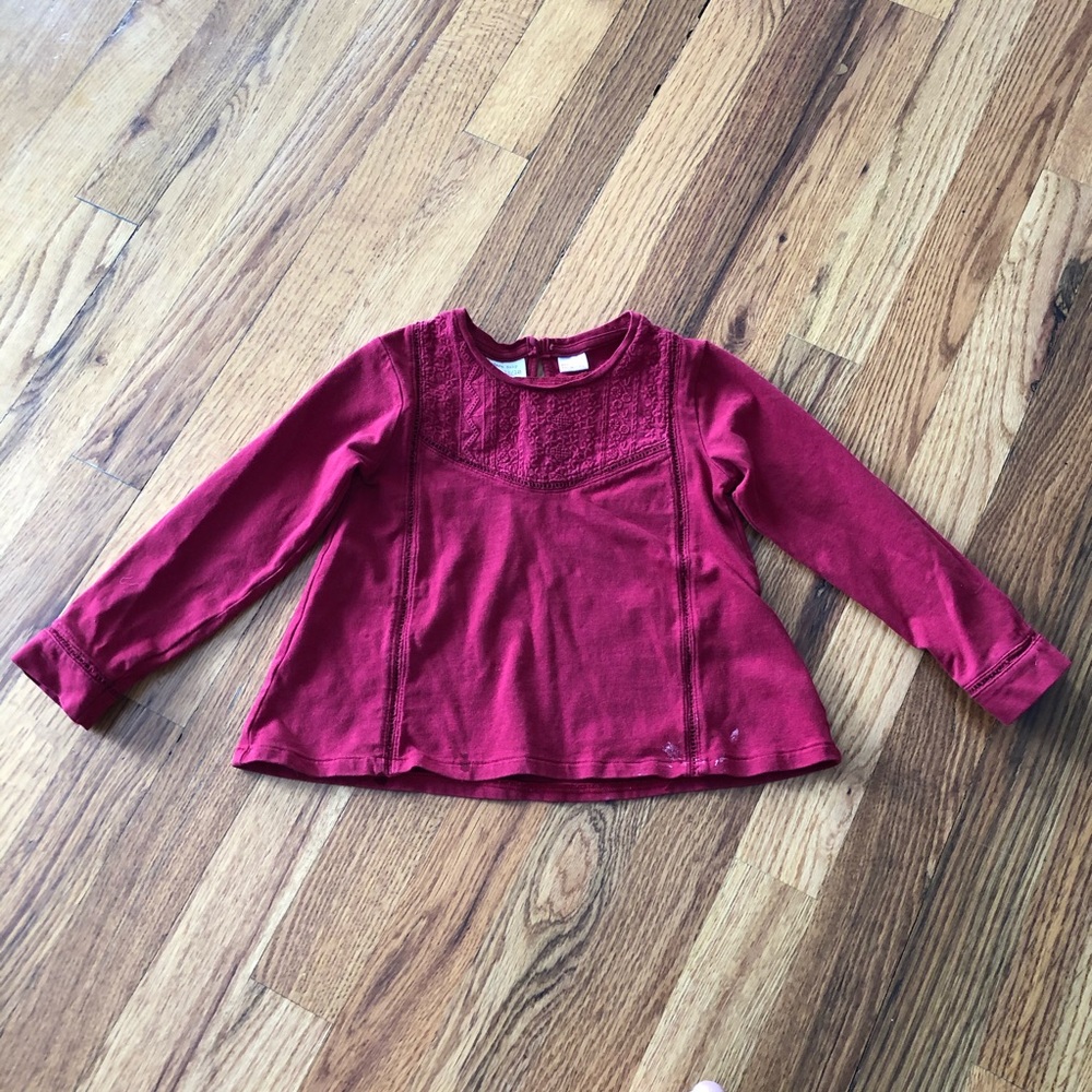 Long sleeve t-shirt. Color is really red.